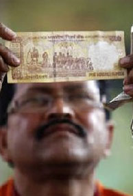 Rupee hits 54 to a Dollar; Possibly More Lows Ahead